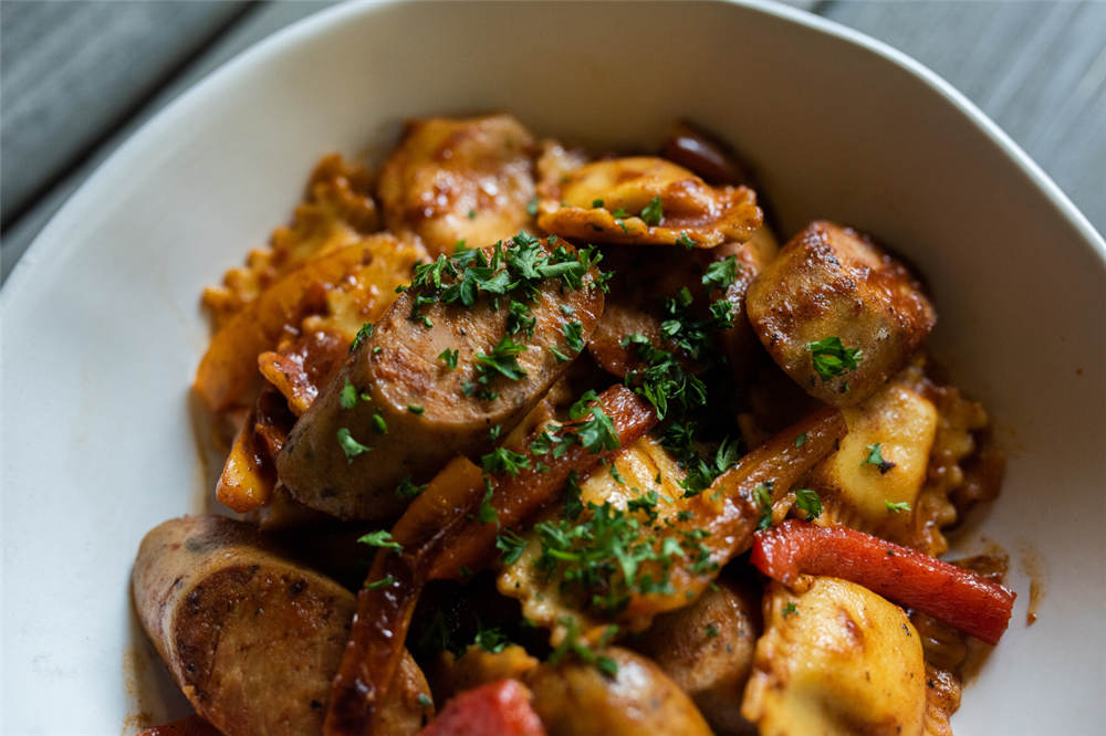 Fresh ravioli with Italian sausages and peppers in tomato sauce